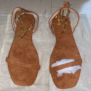 Band new, tan and gold sandals size 8.5